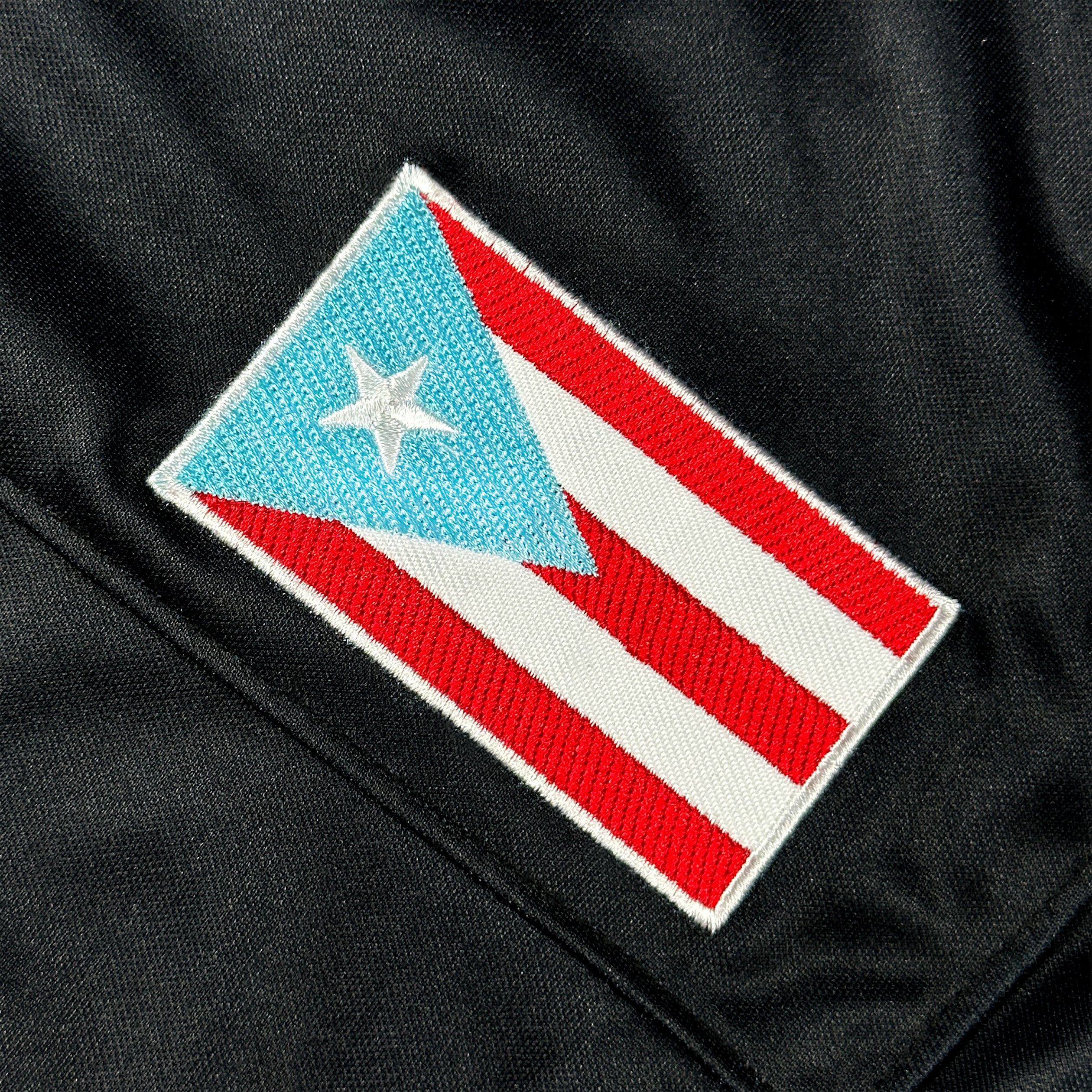 Puerto Rico Borinquen Heritage Black Azul Celeste Custom American Football Jersey Embroidered Closeup Flag